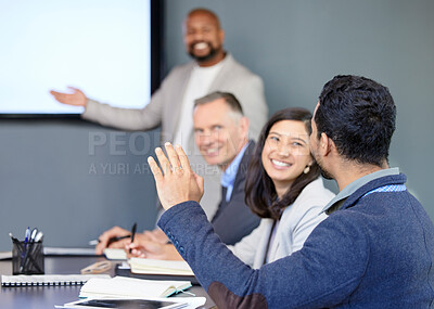 Buy stock photo Shot of a young businessman raising his hand during a meeting in an office