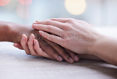 Buy stock photo Shot of two unrecognizable people holding hands