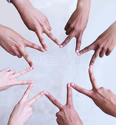 Buy stock photo Shot of a group of unrecognizable businesspeople making a star shape with their hands