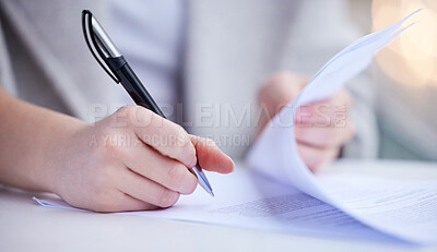 Buy stock photo Shot of an unrecognizable businessperson going through paperwork at work