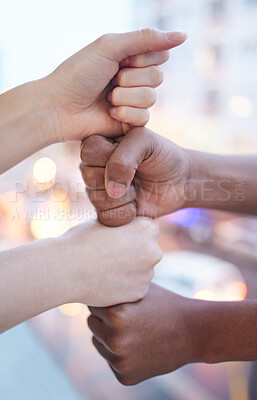 Buy stock photo Shot of two unrecognizable businesspeople stacking their fists on top of each other