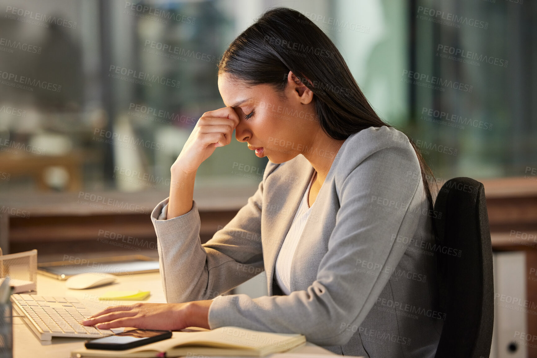 Buy stock photo Headache, stress and sad business woman in night office for burnout, fatigue or mental health problem. Crisis, pain and depressed or tired professional person at desk for mistake, depression or fail
