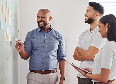 Buy stock photo Shot of three businesspeople having a brainstorming session