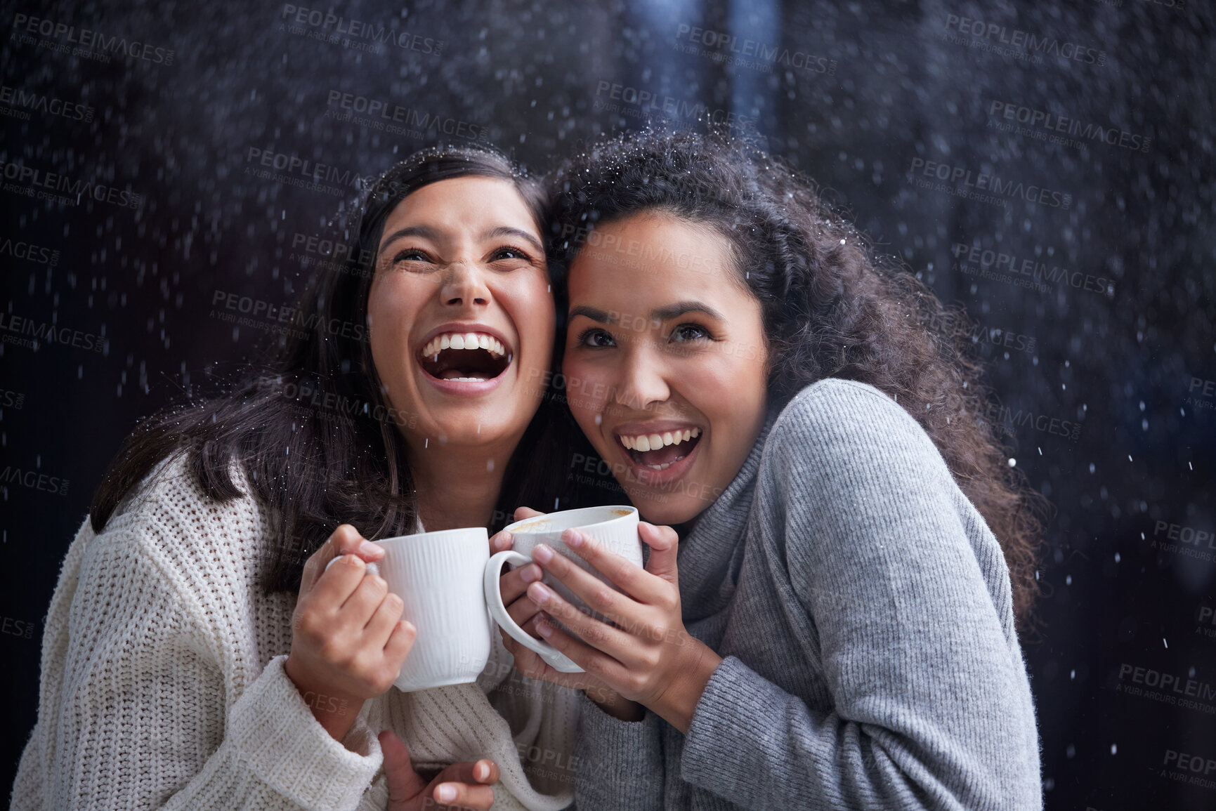 Buy stock photo Women, coffee and snowfall outside for winter holiday at night for Christmas eve with celebration. Laugh, mug and season with happiness for tradition, family and vacation with bonding in America.