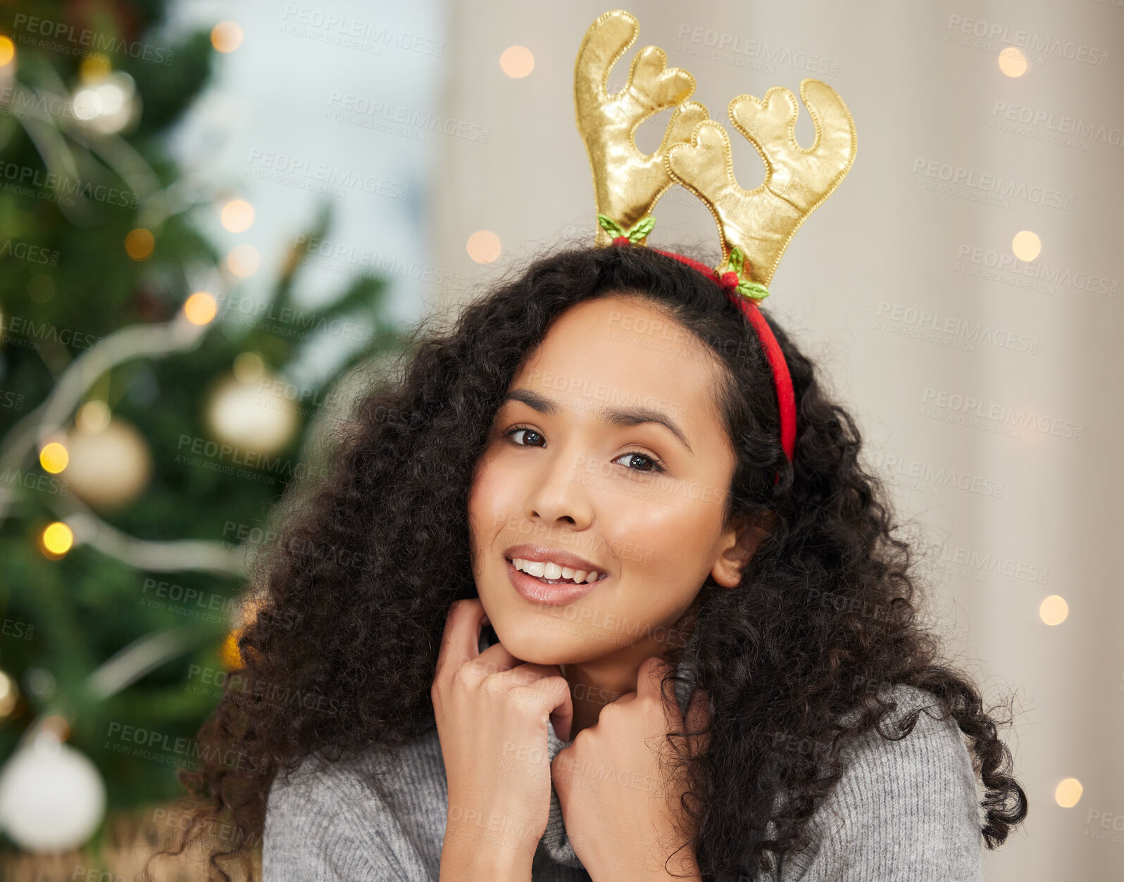 Buy stock photo Portrait of a beautiful young woman wearing a Christmas headband at home