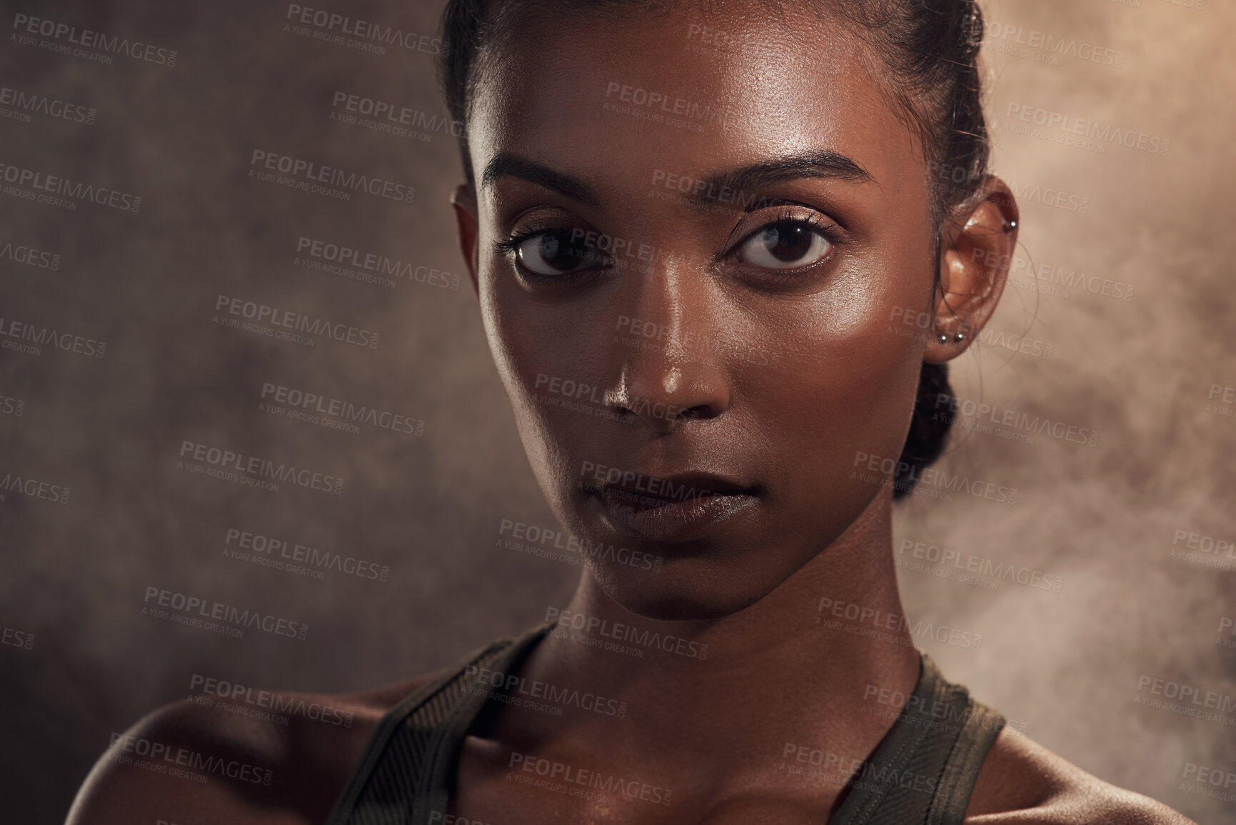 Buy stock photo Shot of an attractive young woman standing alone and posing in the studio