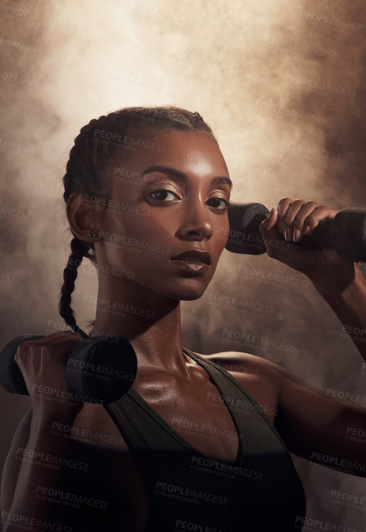 Buy stock photo Woman, dumbbells and fitness with smoke in studio for portrait, strong muscle and pride on dark background. Girl, bodybuilder and confidence with gear, equipment and strength training in Sri Lanka