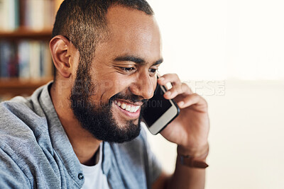Buy stock photo Shot of a businessman working from home using his smartphone to make a phone call