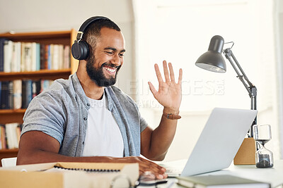 Buy stock photo Shot of a young businessman using his laptop to make a video call