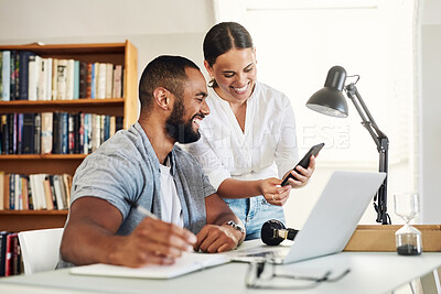 Buy stock photo Shot of a young businesswoman showing her husband her smartphone