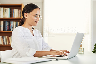 Buy stock photo Shot of a beautiful young businesswoman working from home