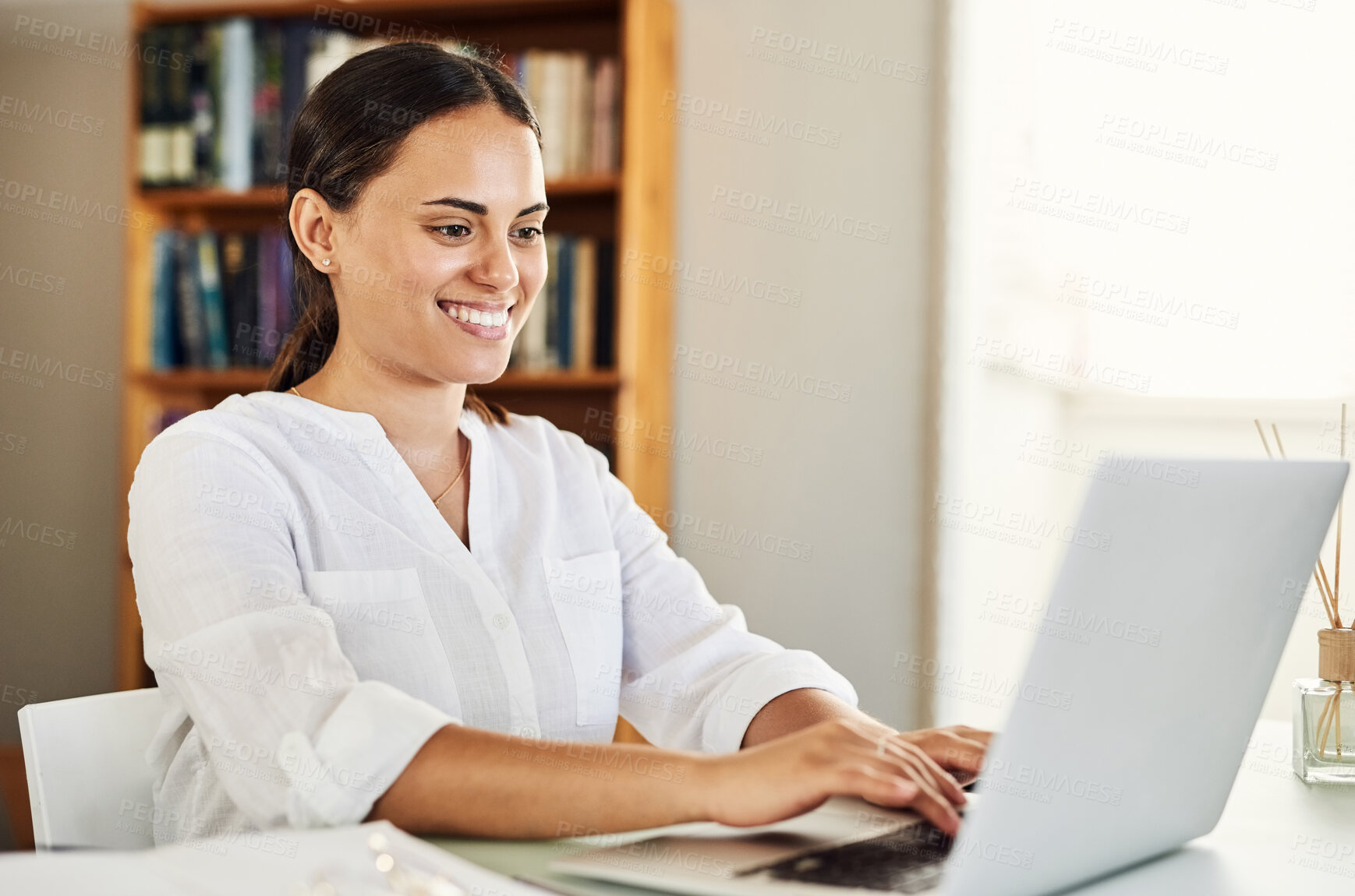 Buy stock photo Shot of a beautiful young businesswoman working from home