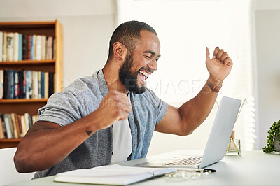 Buy stock photo Shot of a handsome businessman looking excited while working from home