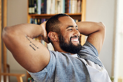 Buy stock photo Shot of a young businessman taking a break from working at home