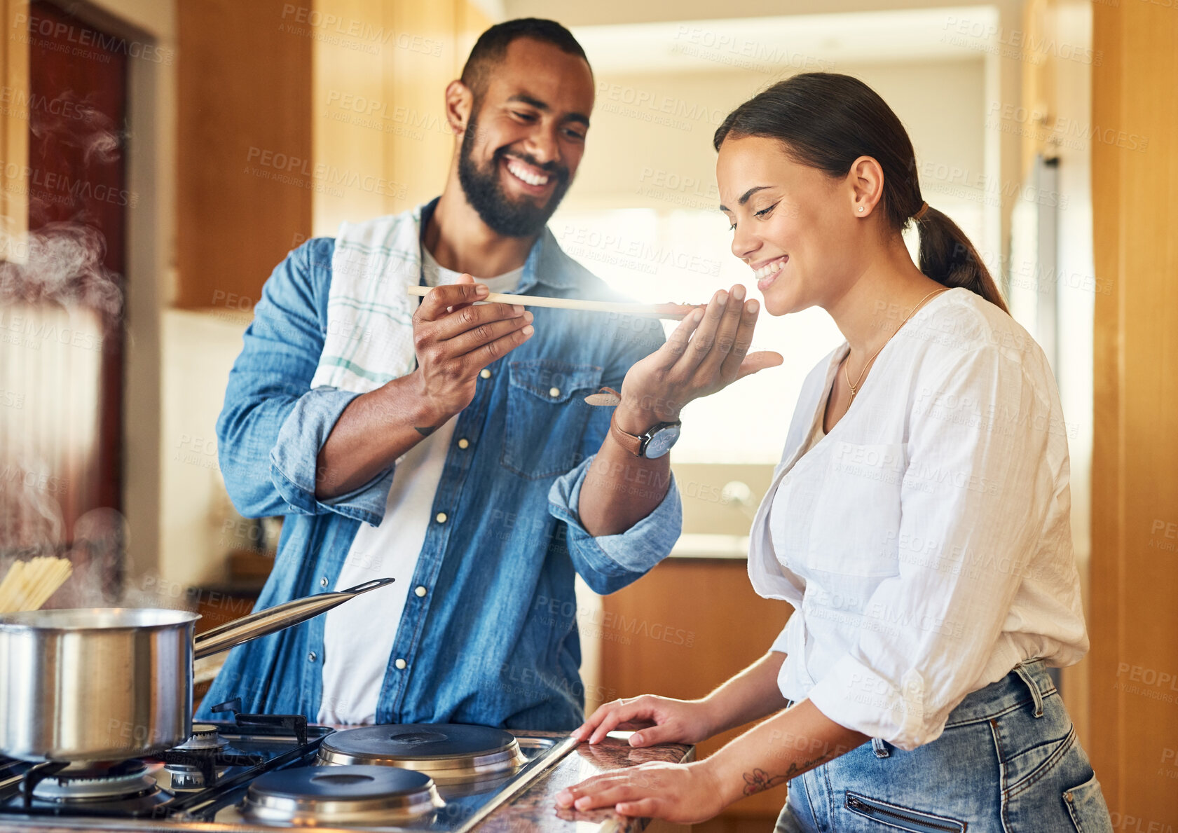 Buy stock photo Shot of a couple cooking together at home