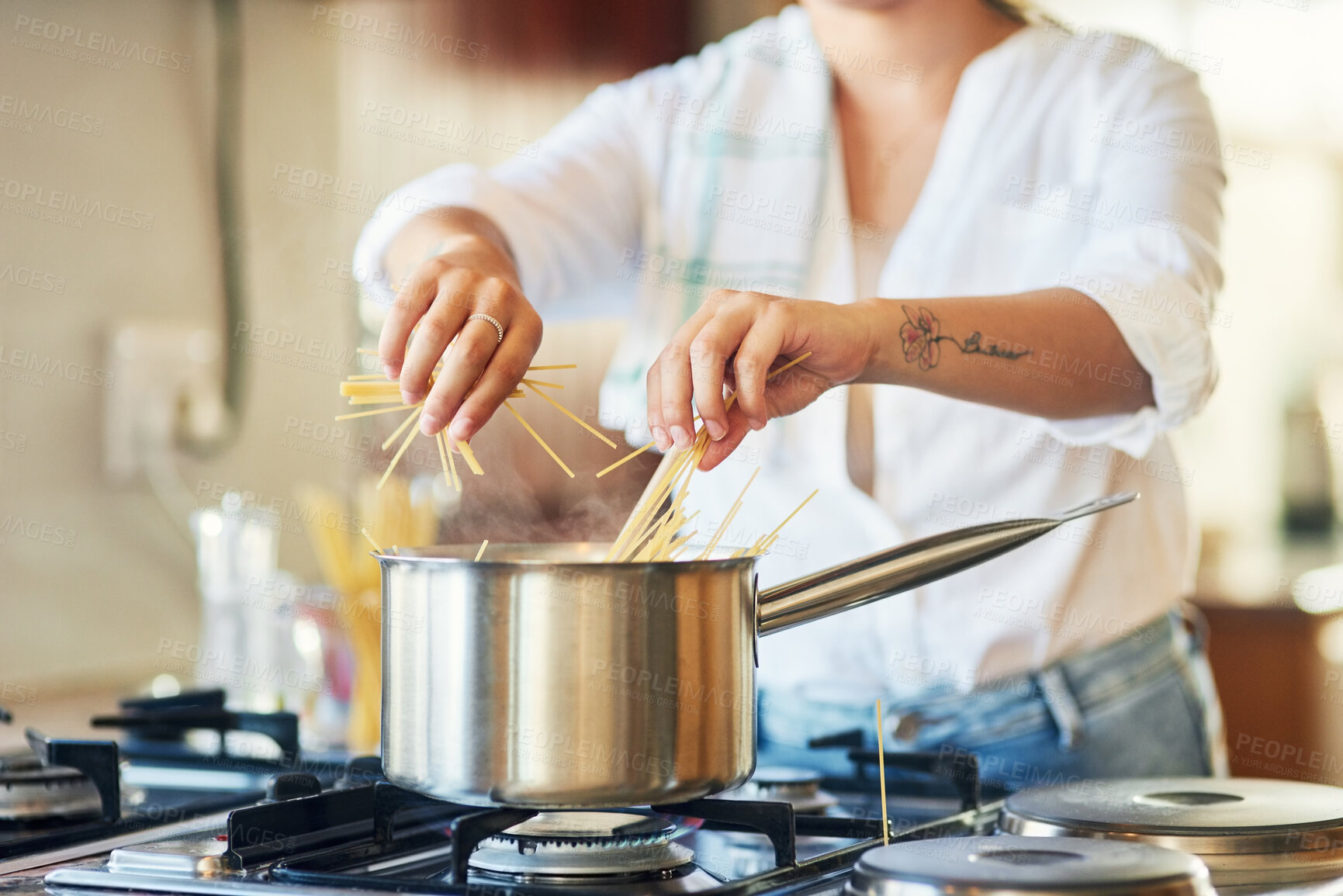 Buy stock photo Cooking, preparation or hands in home with spaghetti, organic meal or boiling pasta in dinner recipe. Process, food or woman at stove with pot, healthy supper or noodle dish in homemade cuisine.