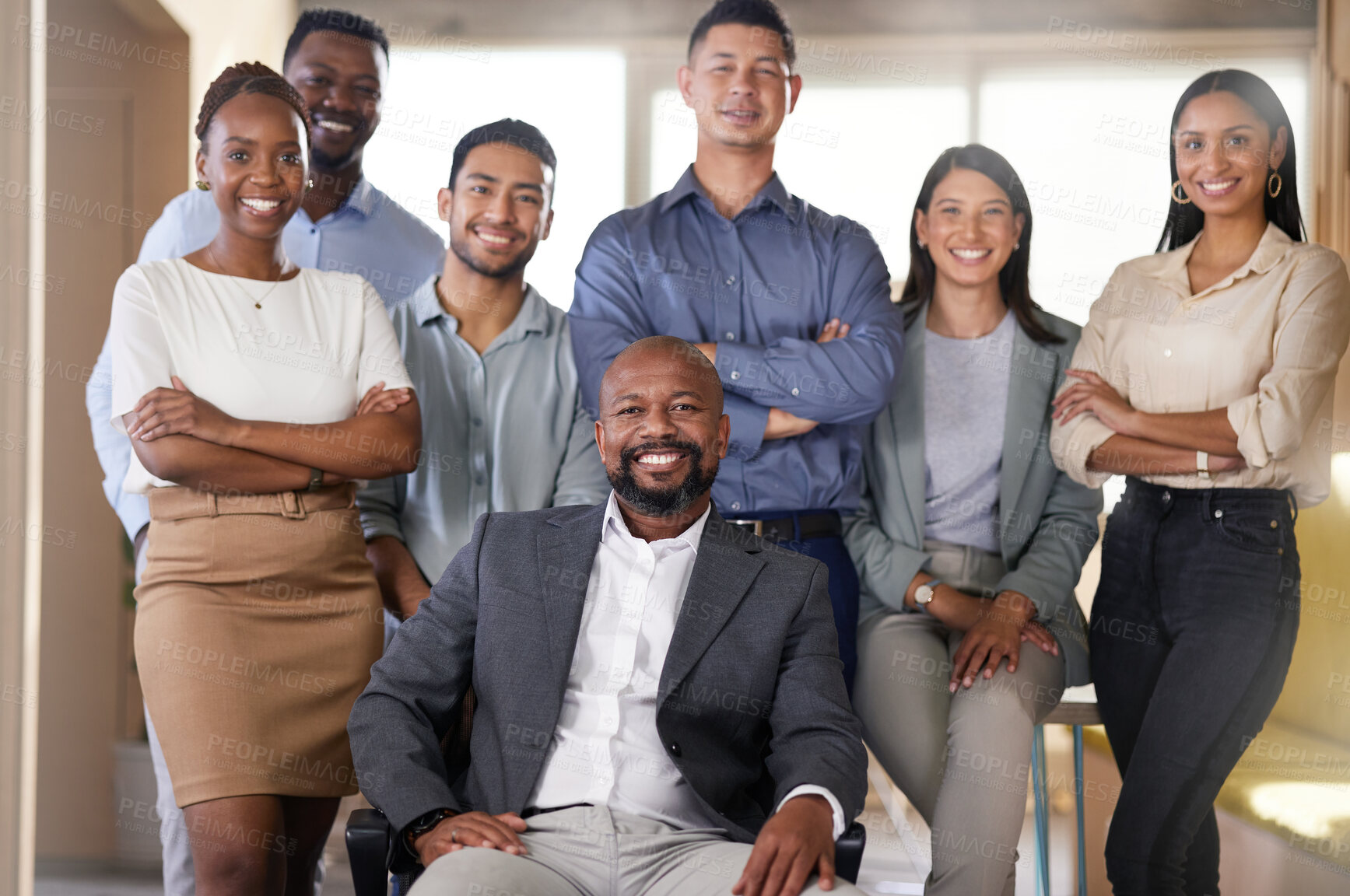 Buy stock photo Cropped portrait of a diverse group of businesspeople posing in their office