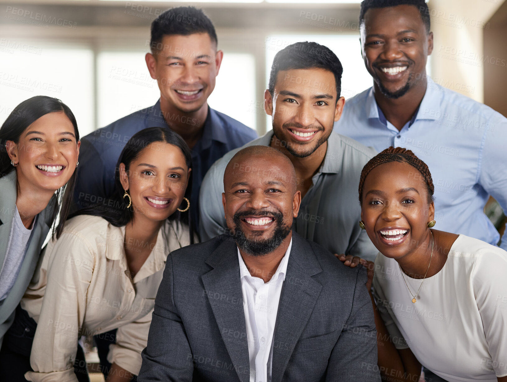 Buy stock photo Cropped portrait of a diverse group of businesspeople posing in their office