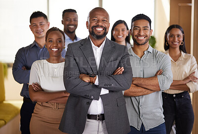 Buy stock photo Cropped portrait of a diverse group of businesspeople standing with their arms folded in the office
