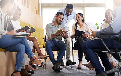 Buy stock photo Cropped shot of a diverse group of businesspeople sitting in the boardroom during a meeting