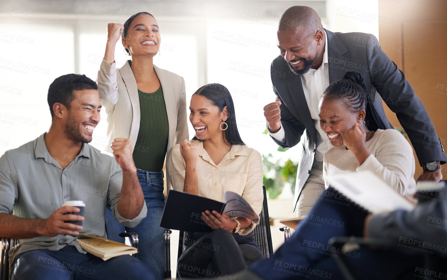 Buy stock photo Cropped shot of a diverse group of businesspeople cheering while sitting in the boardroom during a meeting