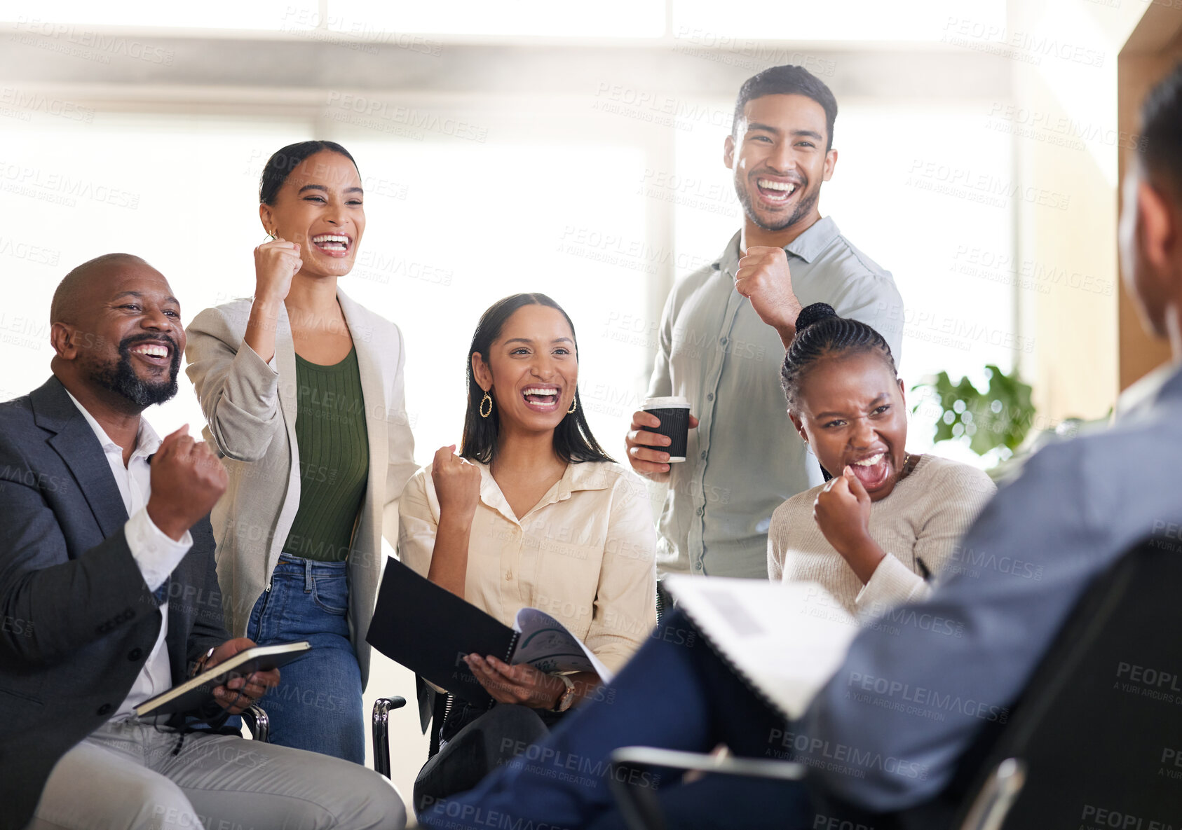 Buy stock photo Cropped shot of a diverse group of businesspeople cheering while sitting in the boardroom during a meeting