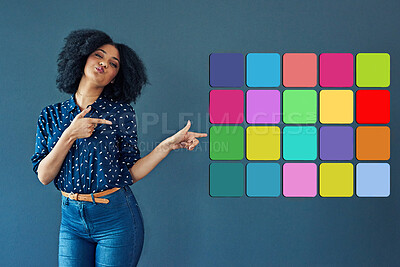 Buy stock photo Studio shot of a young woman pointing towards various notification icons against a gray background
