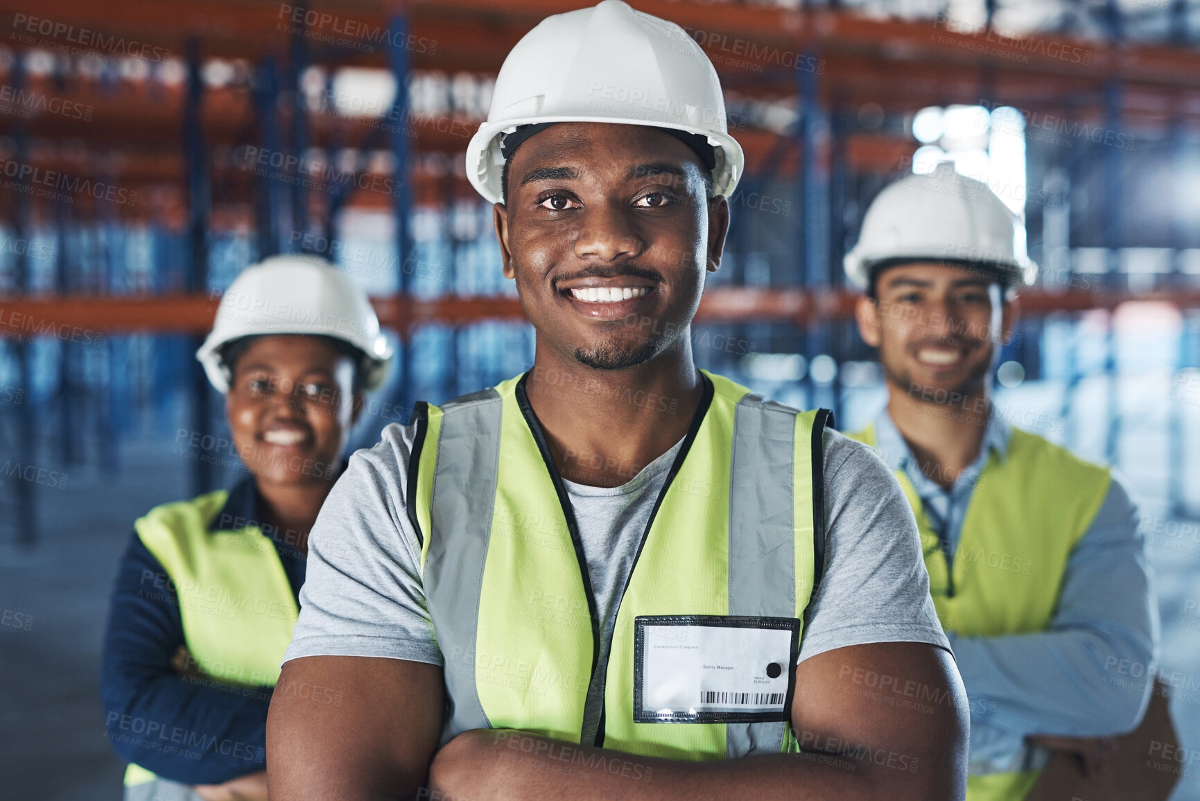 Buy stock photo Shot of a group of contractors standing in the warehouse together with their arms folded