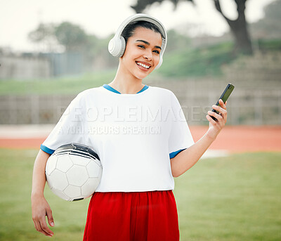 Buy stock photo Cropped portrait of an attractive young female footballer standing outside with a soccer ball in hand