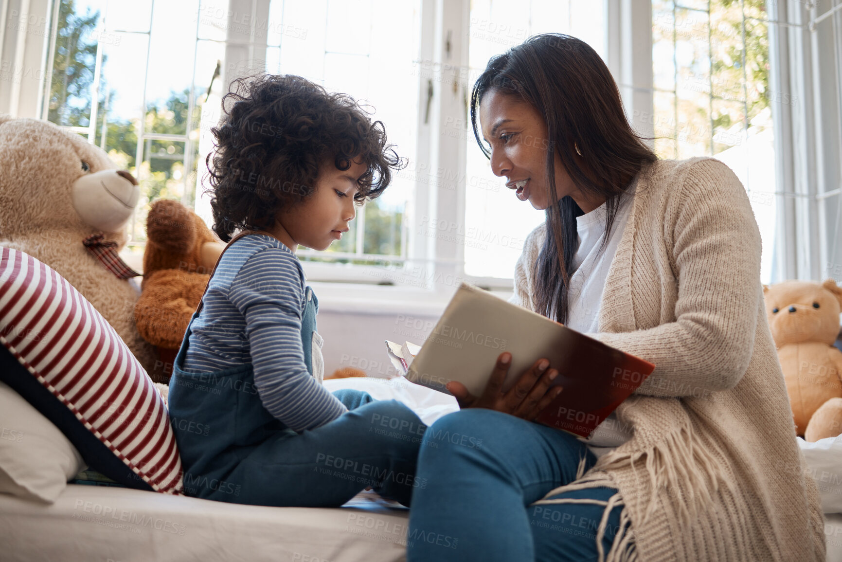 Buy stock photo Shot of a young woman spending quality time with her adorable child at home