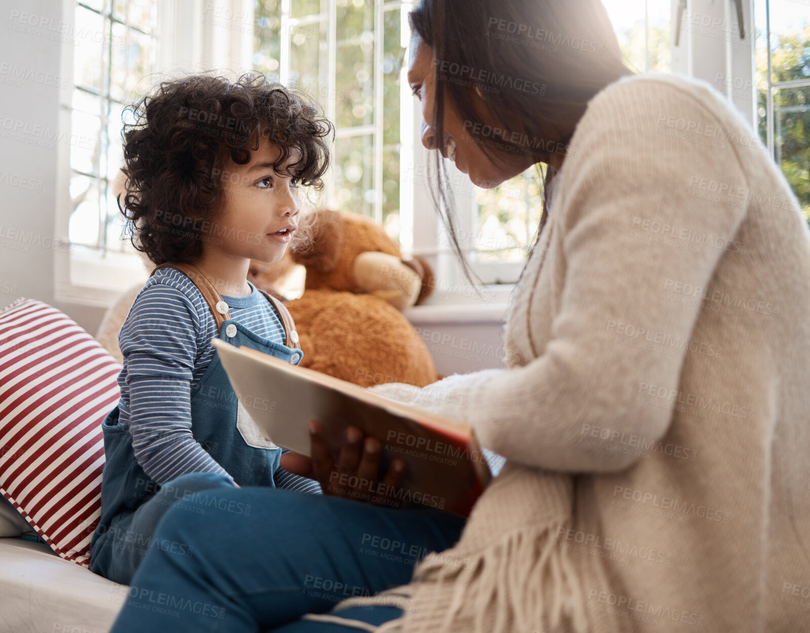 Buy stock photo Shot of a young woman spending quality time with her adorable child at home