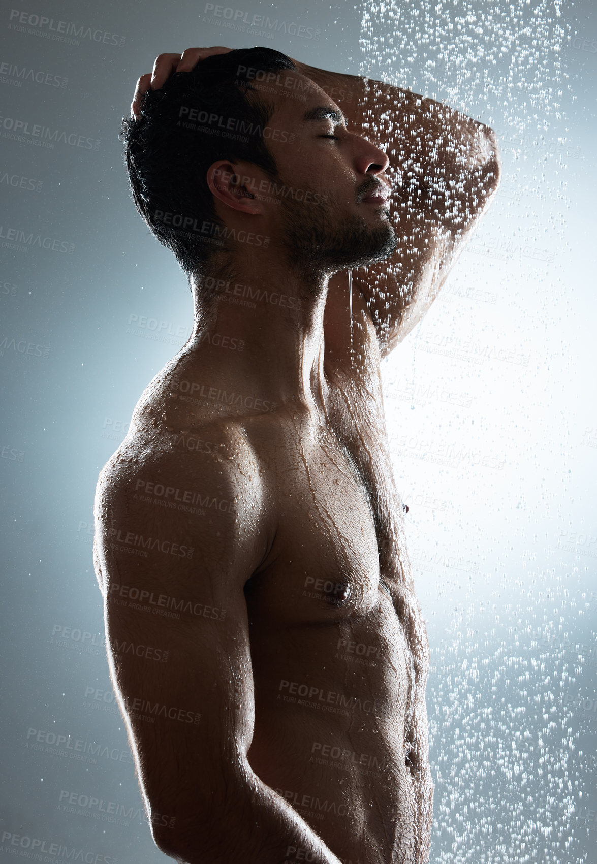 Buy stock photo Man, shower and washing in studio for hygiene, cosmetics and cleaning on gray background. Male person, profile and water drops for pamper treatment or dermatology, grooming and hydration beauty