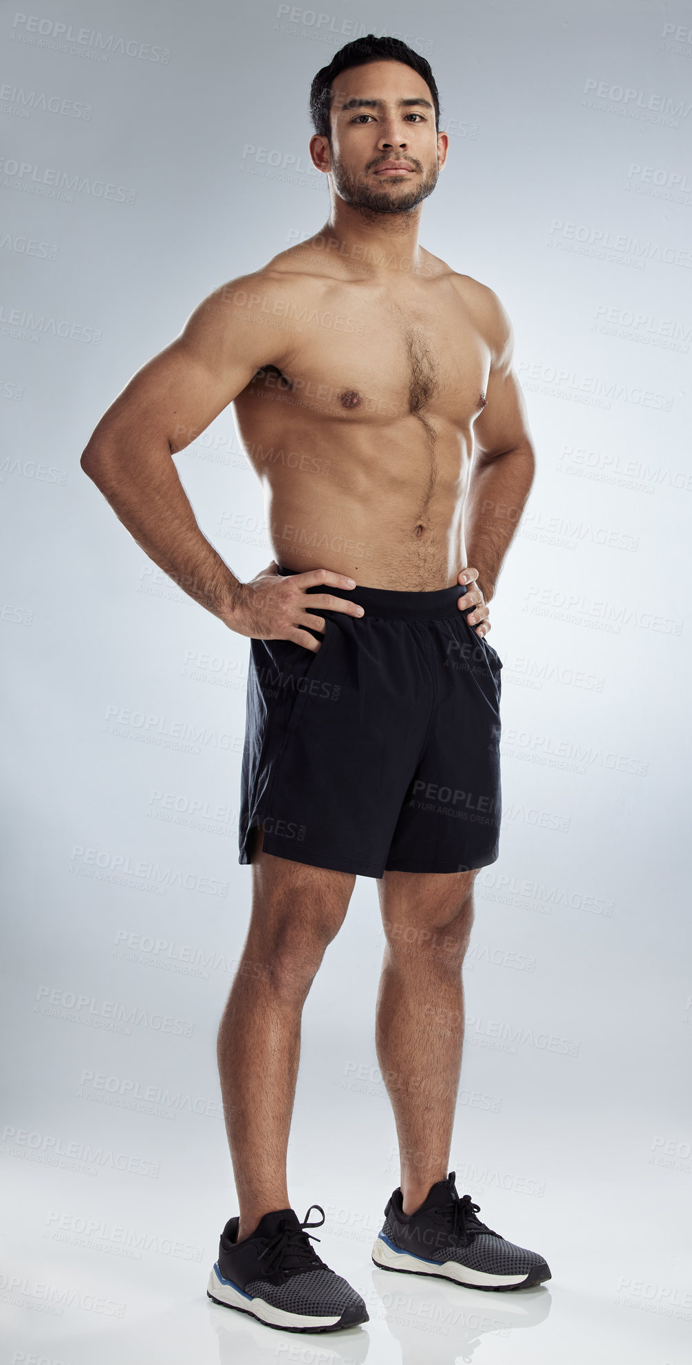 Buy stock photo Shot of a handsome young man against a studio background