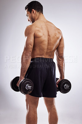 Buy stock photo Fitness, man and dumbbells or back in studio with body builder, strength and training for power workout. Athlete, strong muscles and wellness on white background, weight lifting and exercise