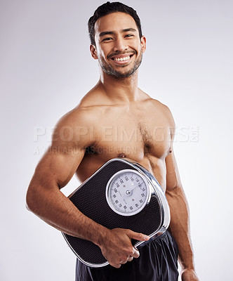 Buy stock photo Portrait, happy man and scale for fitness in studio for body care, wellness or health diet for muscles. Male person, athlete or bodybuilder and smile for weight loss or exercise by white background