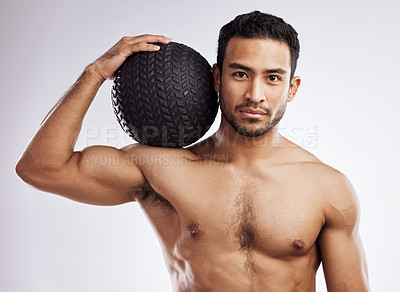 Buy stock photo Portrait, athlete and man with medicine ball in studio for body care, wellness and health for muscles. Male person, bodybuilder and workout or training for weight loss and fitness by white background