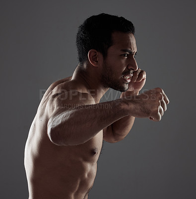 Buy stock photo Man, boxer and punch in studio for workout for mma sport, fighter and background or training for challenge or competition fight. Strong, power and exercise for strength, combat fitness and health