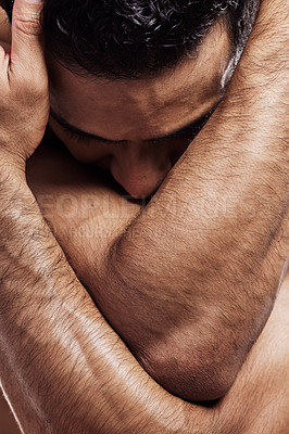 Buy stock photo Shot of a man folding his arms around himself