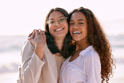 Buy stock photo Shot of two best friends standing outside with their arms around each during the day