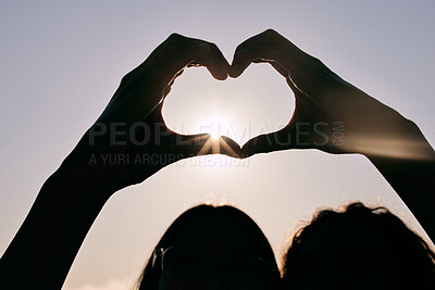 Buy stock photo Silhouette, heart hands and couple at sky for sunset, love and care together on summer holiday with flare. Sign, closeup and romance at beach with fingers for peace, support and connection emoji
