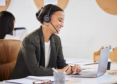Buy stock photo Shot of a young businesswoman working on a laptop in a call centre
