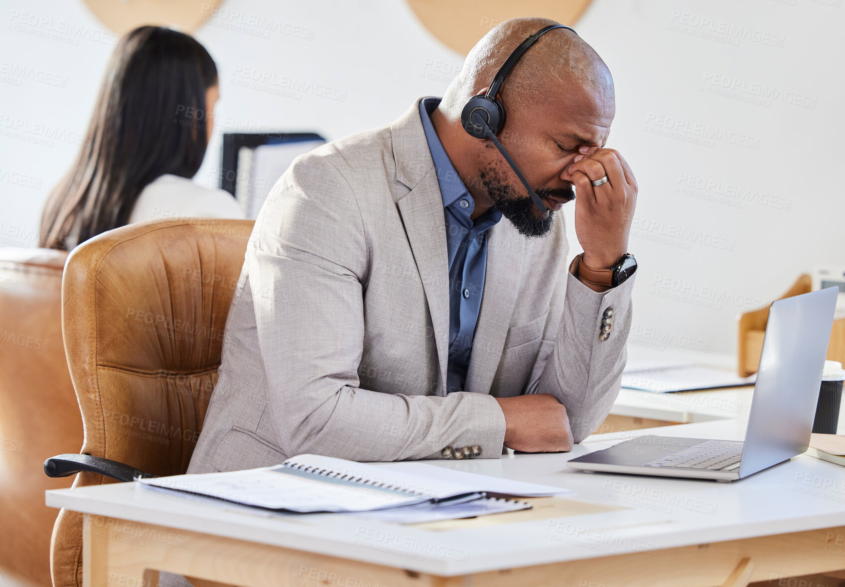 Buy stock photo Office, black man and frustrated with stress in call center for crm mistake, glitch and client problem for inbound telemarketing. Male advisor, tired and burnout or headache for customer service job.
