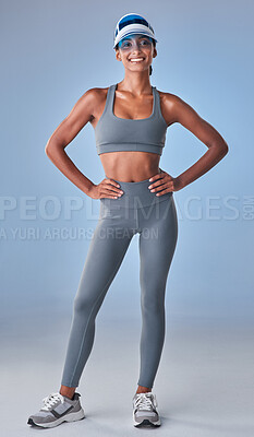 Buy stock photo Studio shot of a fit young woman posing against a grey background