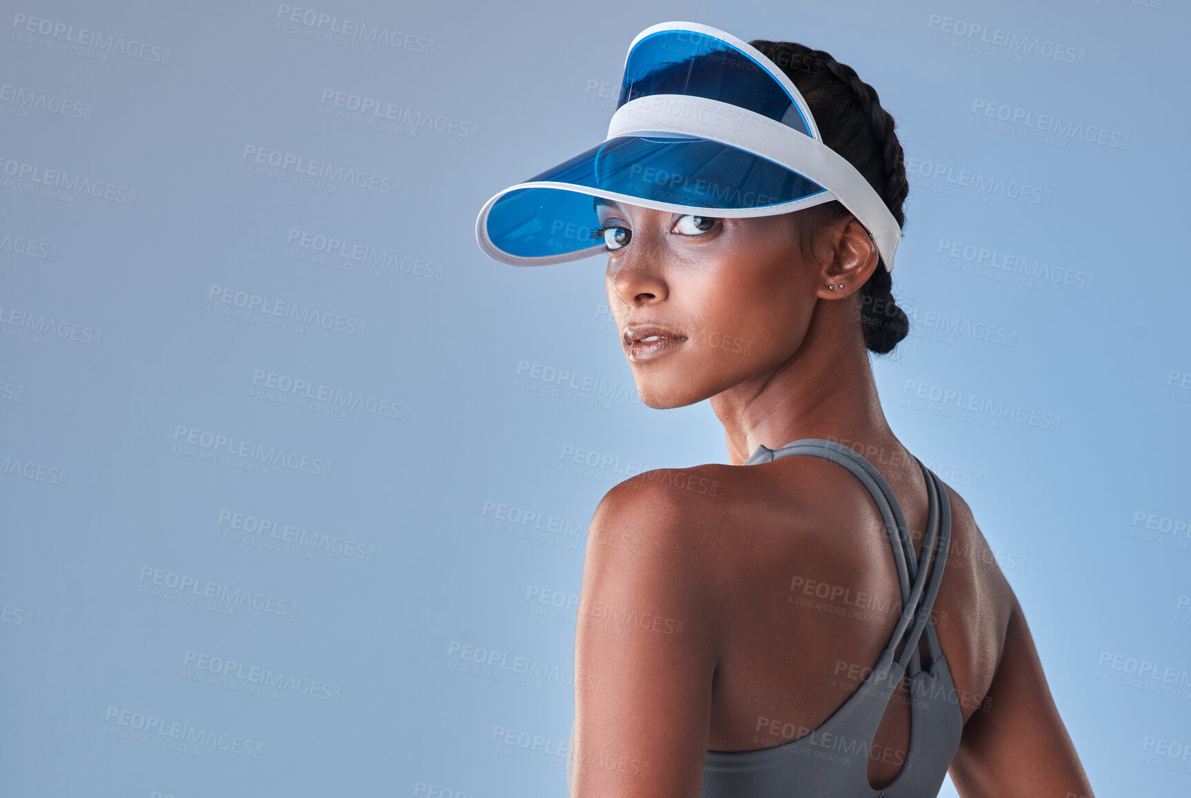 Buy stock photo Studio shot of a fit young woman posing against a grey background