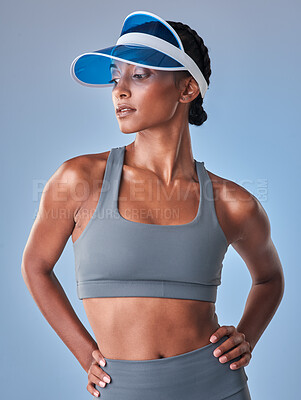 Buy stock photo Studio shot of a fit young woman posing against a grey background