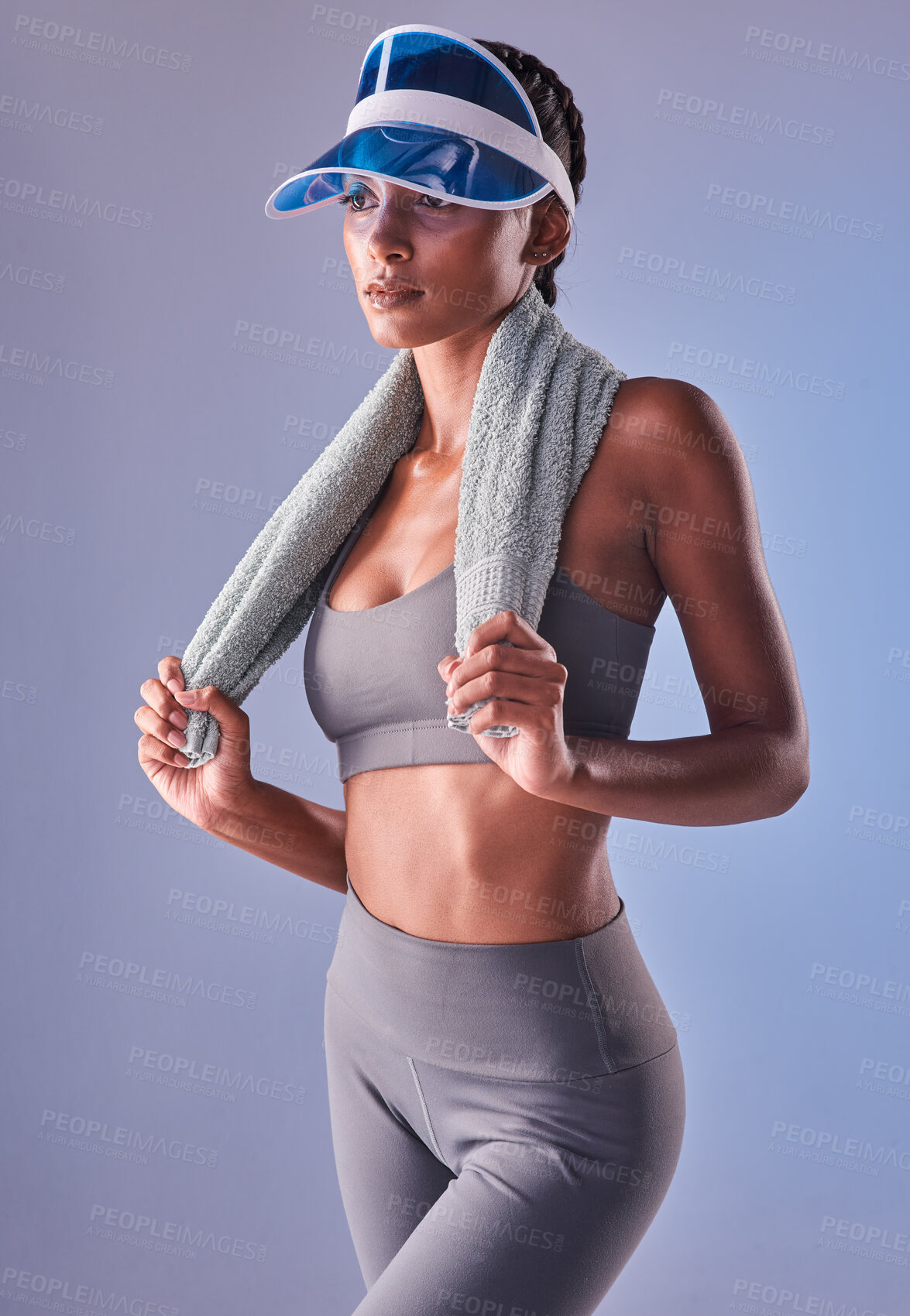 Buy stock photo Studio shot of a fit young woman working out against a grey background