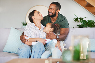 Buy stock photo Shot of a happy family relaxing together at home