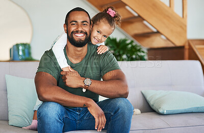 Buy stock photo Portrait of a father and his little daughter relaxing together at home