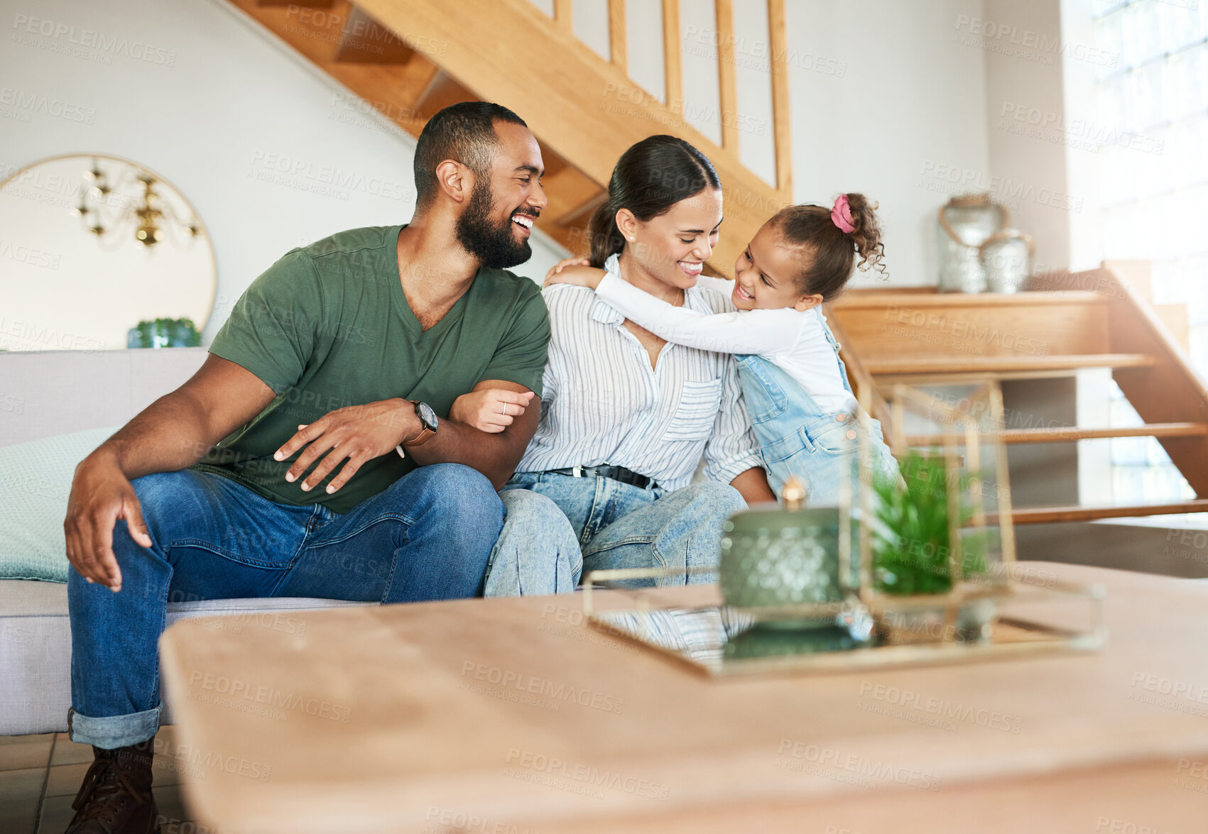 Buy stock photo Shot of a happy family relaxing together at home