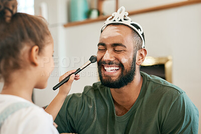 Buy stock photo Shot of a little girl putting makeup on her father while playing together at home